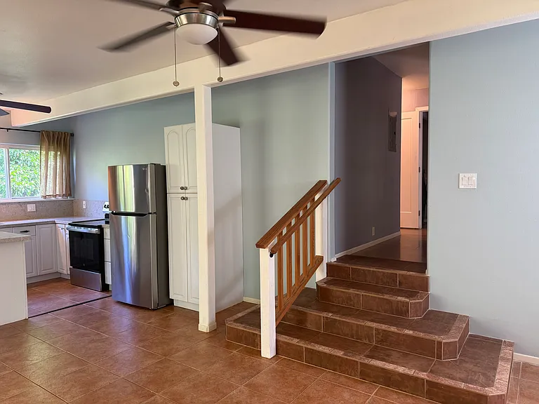 Steps up to bedroom and bathroom area