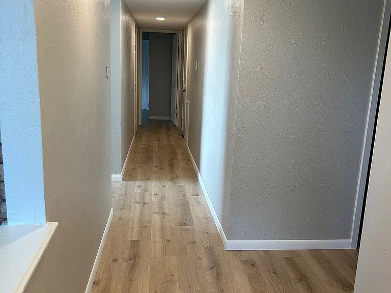 Split bedroom arrangement. Masterbedroom at end of hall. Two guest bedrooms at front of home.