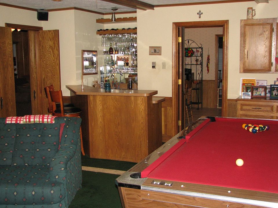 Game Room/Den/LR2 full service bar w/ Refrigerator and sink.