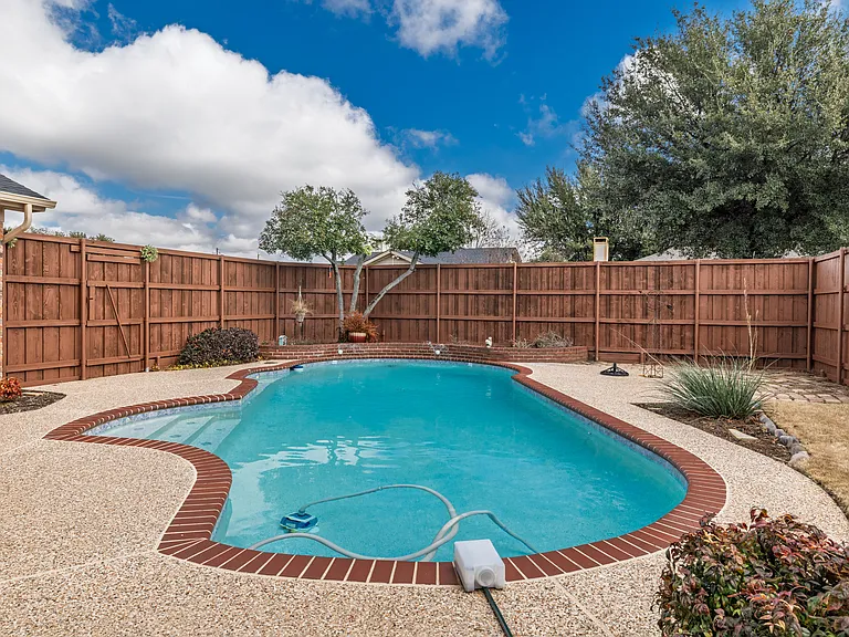 Family friendly swimming pool in private backyard
