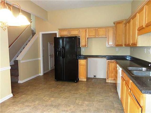 Kitchen with laundry room off the back-garage entry and bonus room up