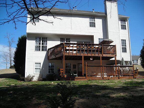 1/2 acre of privacy! Custom deck AND patio!