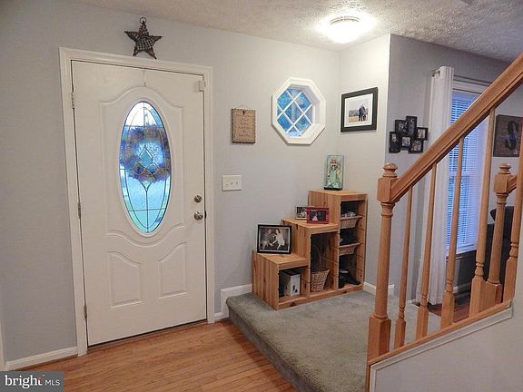 Updated front door, wood floors in foyer