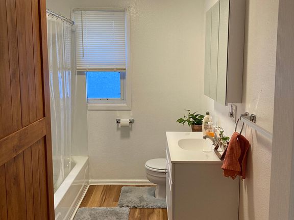 Barn door on left conceals ample storage.