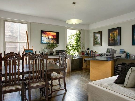 Open floor plan & large double pane windows allow for natural light throughout flat!