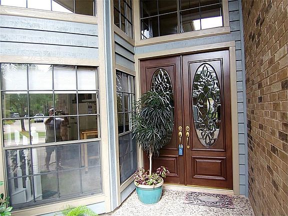 Beautiful Entry featuring double bevelled leaded glass front doors
