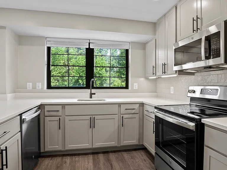Select homes feature upgraded kitchens with quartz countertops and wood flooring