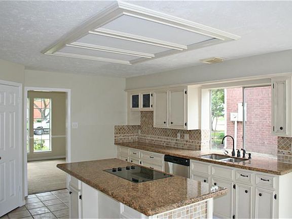 Kitchen has wonderful natural lighting, a huge island, refinished cabinets and a huge pantry.  You will love preparing meals in this space!