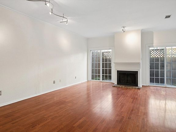 Living Room With Fireplace And Direct Access To Your Private Enclosed Patio