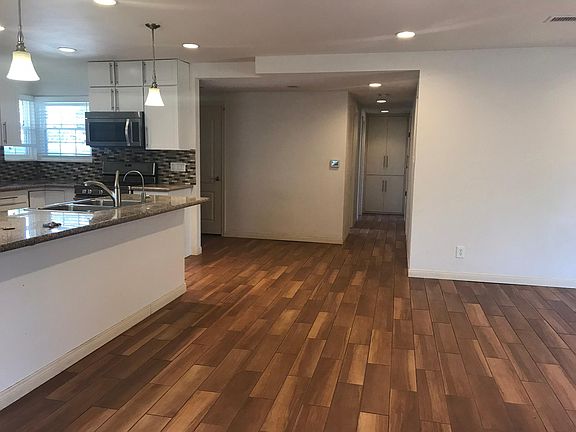 Open Concept. To he left is the Kitchen. Straight a head is the hallway to the bedrooms. To the right is the living room.