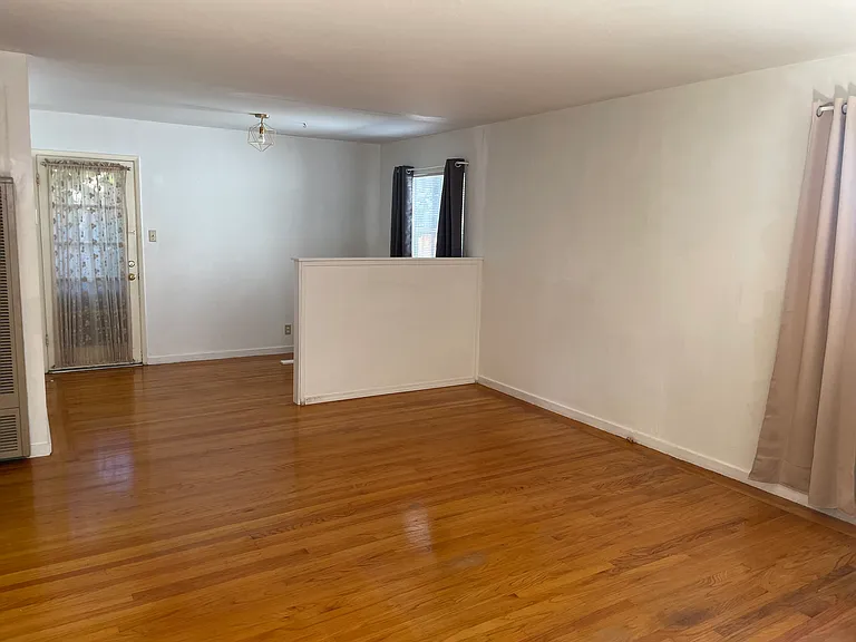 View of dining nook and back patio door from living room