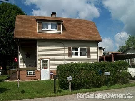 Street side W basement acess door
						:
						Car-port seen in the lower right corner