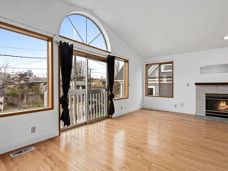 Plenty of light in this living room. Skyline view.