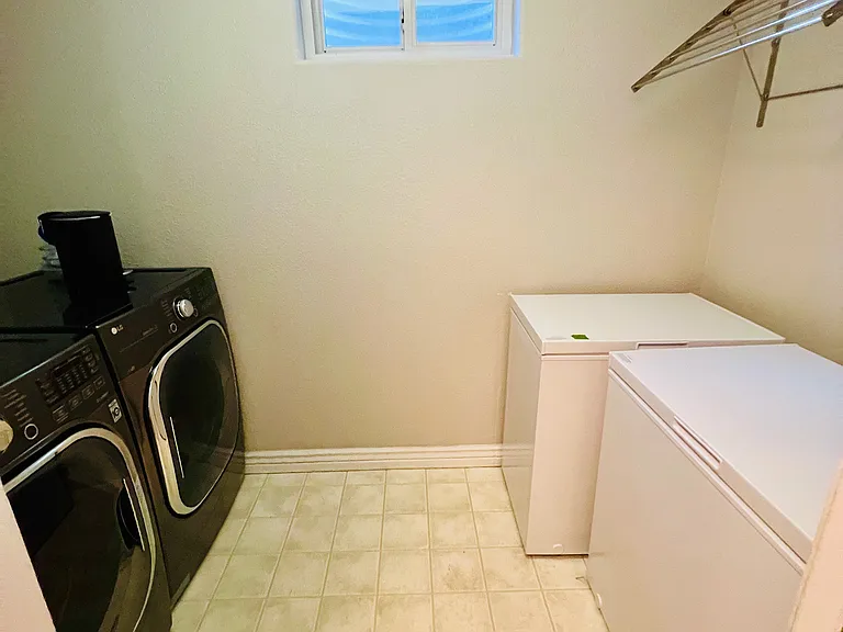 View of the laundry room in the basement.

1 chest freezer included in rental