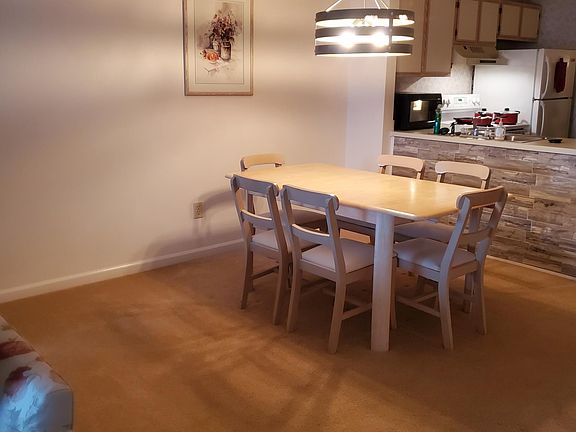 Dining area and partial view of kitchen