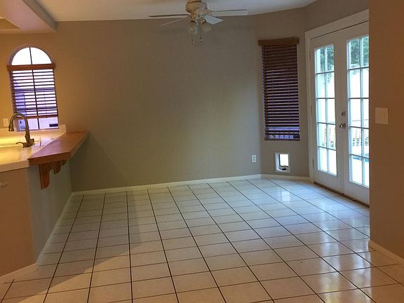 Family room with french doors to pool and covered patio.