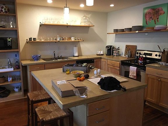 ample storage in island and base cabinets, open shelves