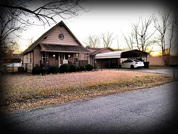 Carport, 2 car garage w/new opener