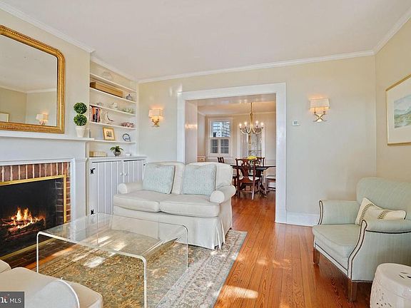 Lovely living room with wood burning fireplace and plenty of light!