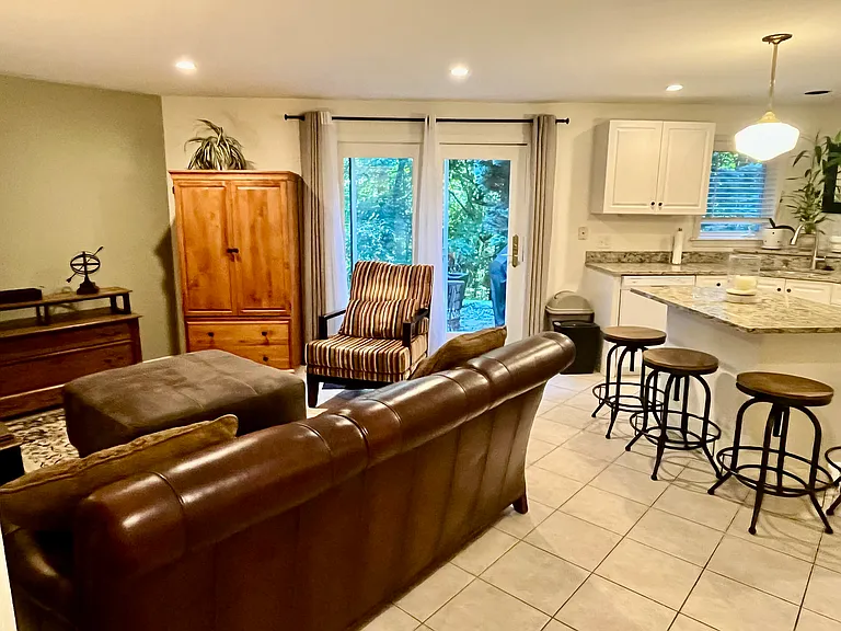 Living room and dinning room with view of the entrance to the patio