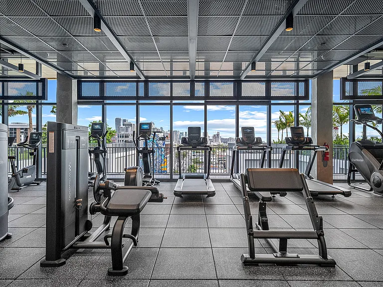 24/7 fitness center with cardio and strength training equipment