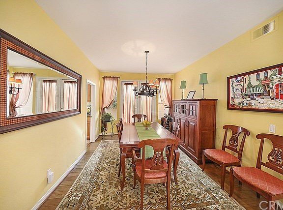 Spacious formal dining room with French doors