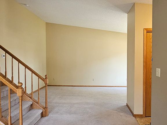 Living room with vaulted ceilings.