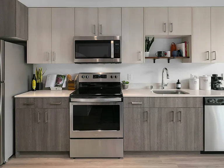 Kitchen with Stainless Steel Appliances and Quartz Countertops