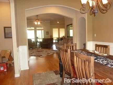 Front Entry : Dining has tiered ceiling w crown molding & lg window that looks out to front.
