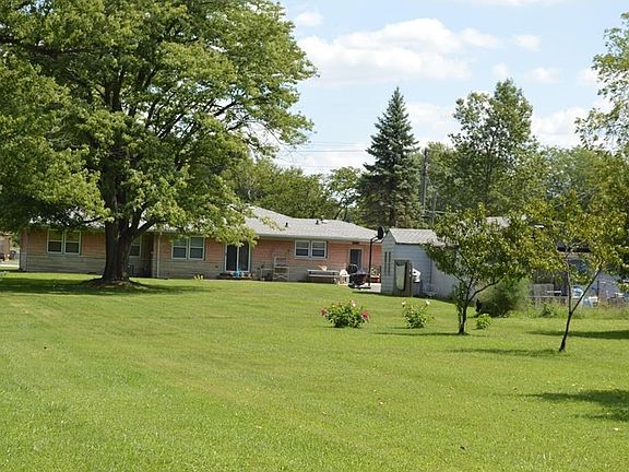This yard just keeps going.  Fruit trees are to the right with lots of open space for any recreation you can think of.