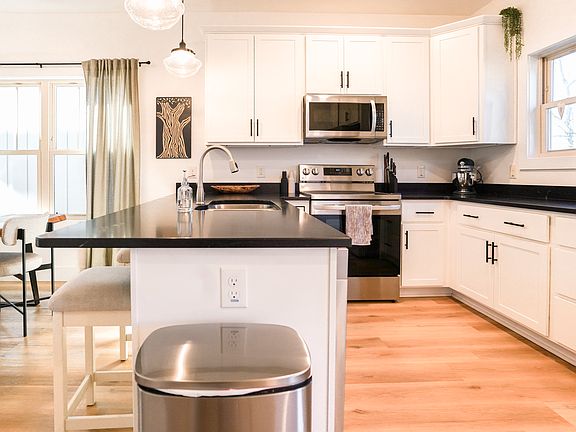Modern kitchen with stainless steel appliances and open_concept layout.