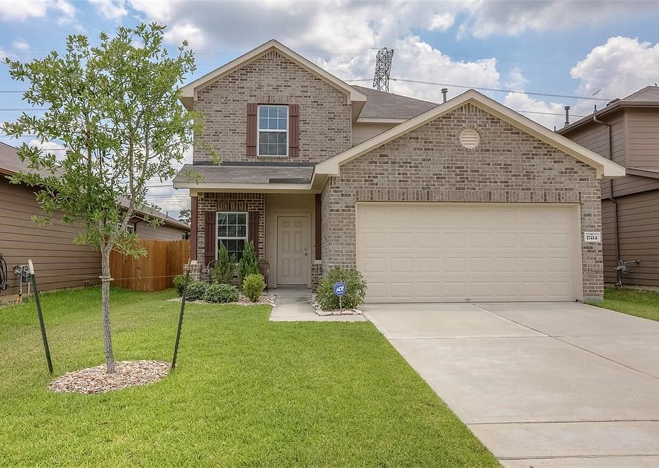 Attractive  and well maintained two story home with covered front porch, brick veneer and decorative shutters.