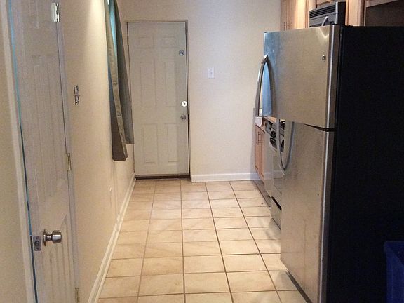 Kitchen leading to backyard