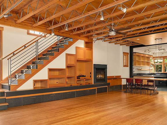 
                    The architectural detailing is awesome. This is the "great room" that combines living/dining kitchen & more... Don't you love that ceiling detail? Bamboo floors (newly refinished) throughout this area.
                