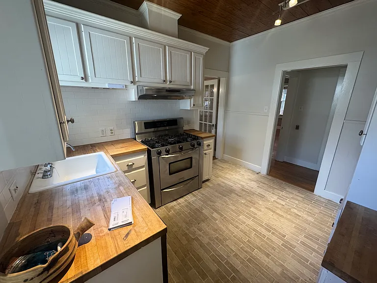 Kitchen, with new refrigerator and microwave as well as a professional gas range