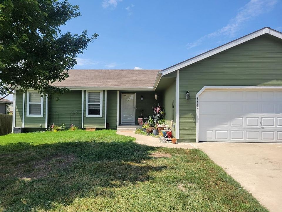 Desirable Ranch home with large driveway and shade,