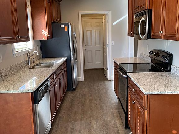 Kitchen complete with all SS appliances and beautiful granite counter tops.