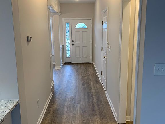 From inside looking down main hallway to back of front door