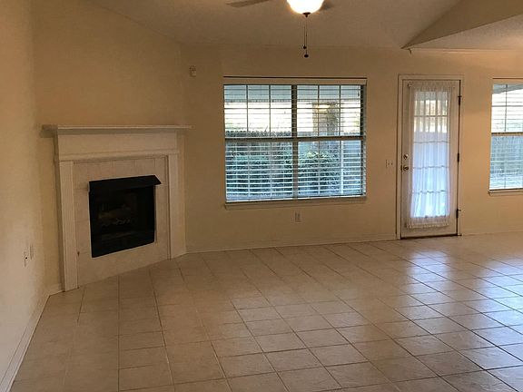 Fireplace in tiled family room