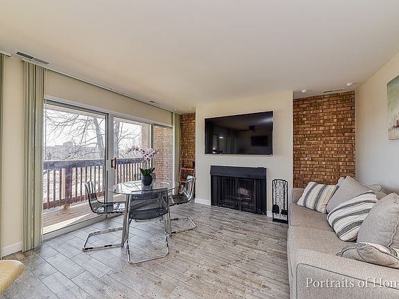 Exposed Brick Walls Flank Fireplace