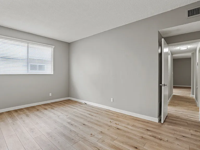 Bedroom with Window and Vinyl Flooring