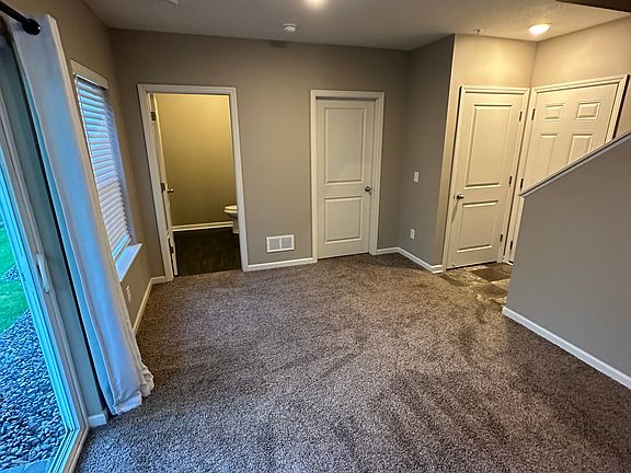 Lower level family room upon entry from garage.