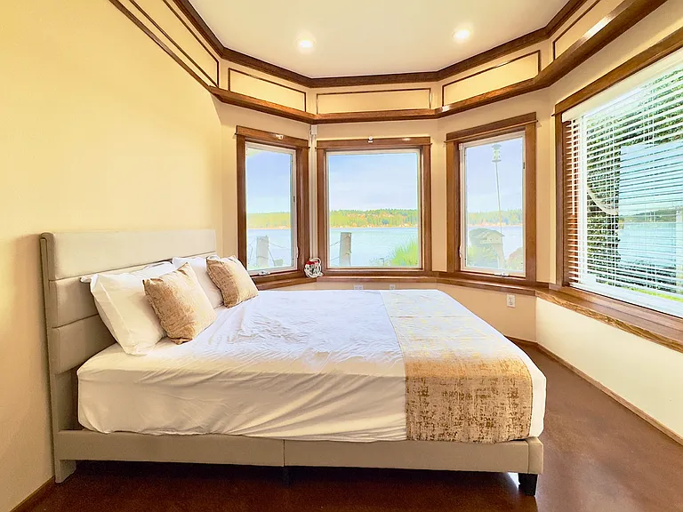 One queen bed with sweeping water views