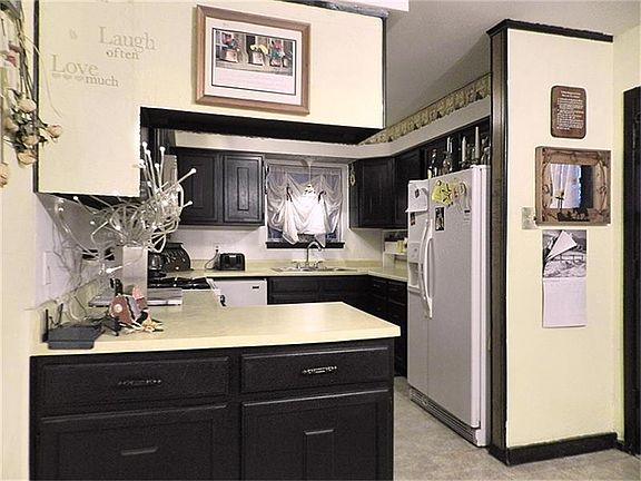 Kitchen features lots of storage - notice the under counter cabinets in the foreground.