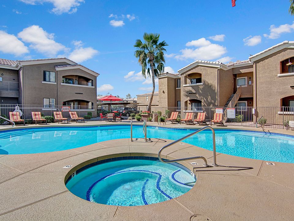An outdoor pool and hot tub