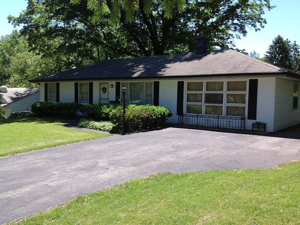 Front with driveway and great room on the right