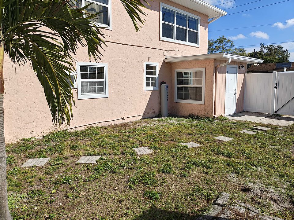 Large, private side yard with brand new white vinyl fence