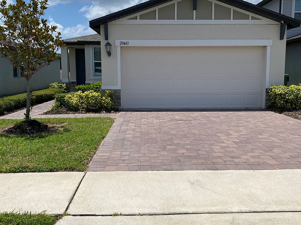 Property is located in Lake Denham Estates. It has a paver driveway and walkway.