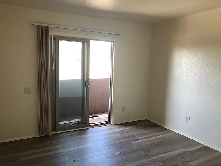 Bedroom with small balcony facing south