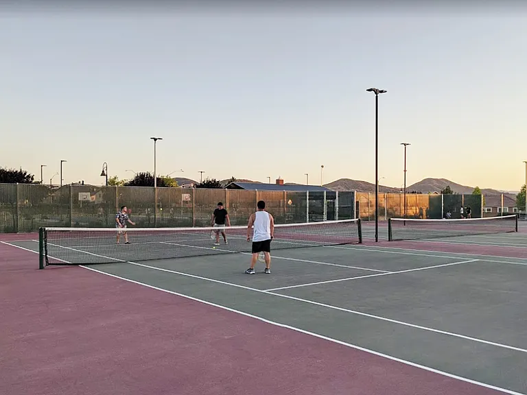 Just minutes away, enjoy a nearby park featuring a tennis court.